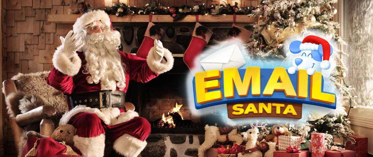 Santa Claus looking at a sign that says "Email Santa"