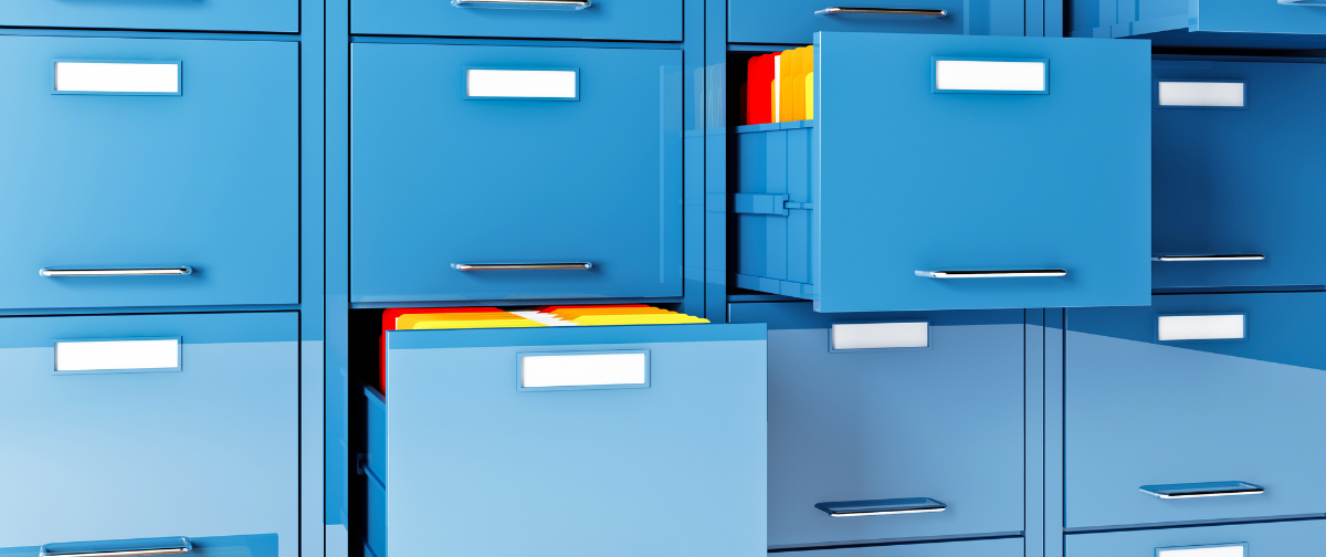 blue filing cabinets with colourful files inside